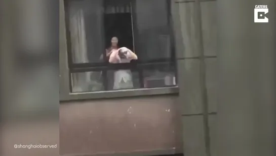 Chinese Man Caught Shampooing His Hair In Heavy Rainfall