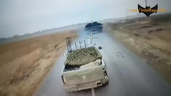 RUSSIAN WIRE-GUIDED DRONE DODGES ELECTRONIC JAMMING PICKUP as if it's simply overtaking it on road, none of the antennas having