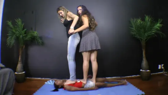 Two girls trampling slave