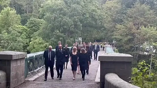 Members of the royal family walked across the bridge over the River Dee