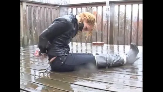 ROPED BLOND STRUGGLING IN THE RAIN