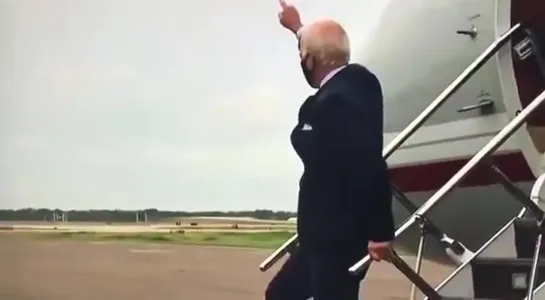 Joe Biden waving to an empty field