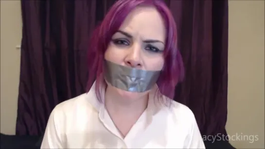 Girl trying to talk with her mouth taped