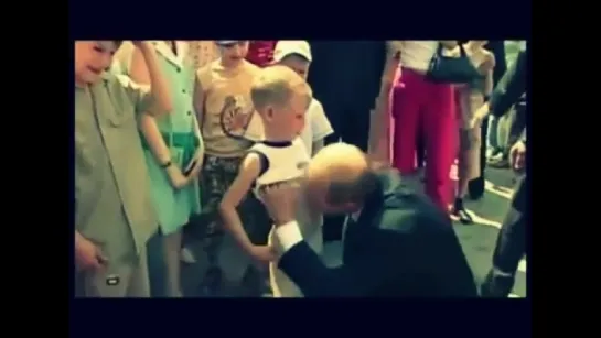 Putin kisses boy