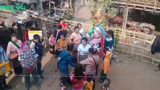 Thailand little boy on woman shoulders