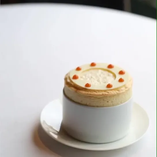 Introducing @petrusrestaurant’s newest dessert.... blood orange, white chocolate and rooibos tea soufflé