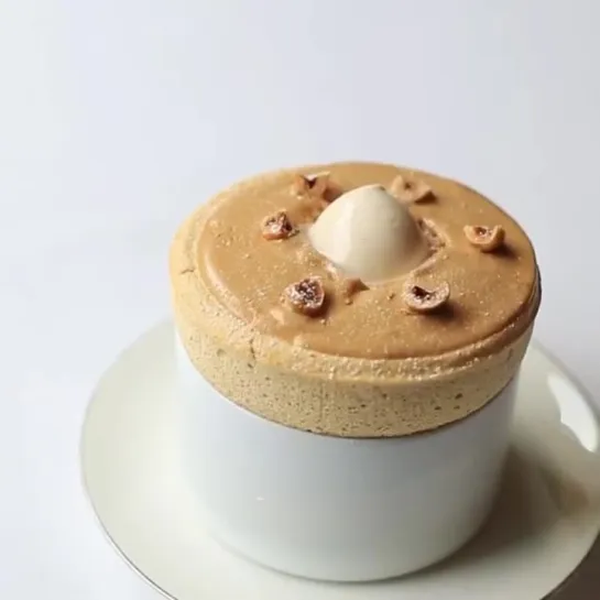 How's that for perfection..... praline soufflé with roast hazelnut ice-cream at @petrusrestaurant