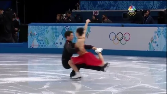 Tessa Virtue and Scott Moir kiss during Sochi 2014 FD warmup