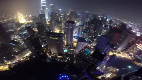 Thats one way to crash a pool party - BASE jumpers in Kuala Lumpur