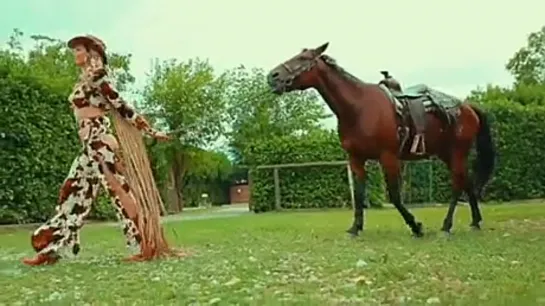 Miss Italy riding a horse