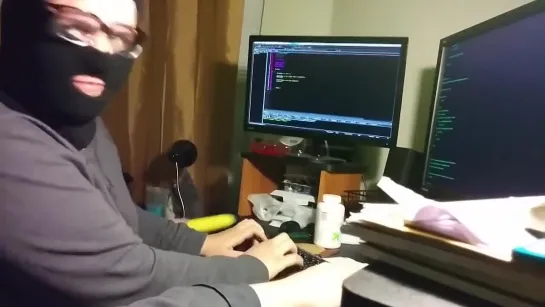 hacker keyboard balaclava Хакер перед компьютером в маске стучит взламывает  по клавиатуре бананом