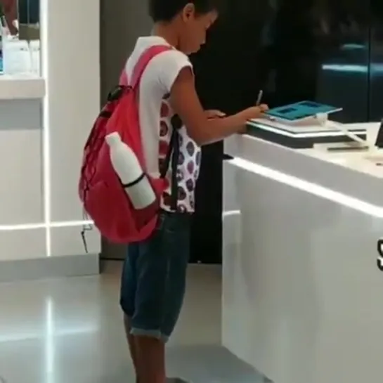 An electronic store in the mall allows a kid to use their tablet for school homework because he doesn't have internet access at