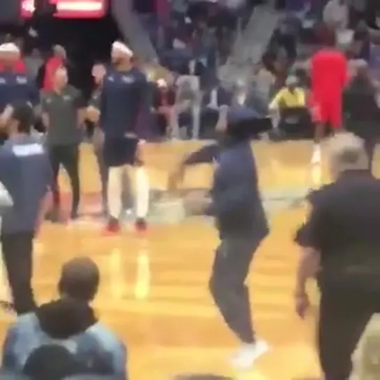 Fan dressed up as an NBA player and actually got some shots during warm ups