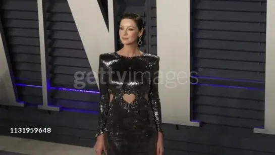 Caitriona Balfe posing at Vanity Fair Oscar Party 2019