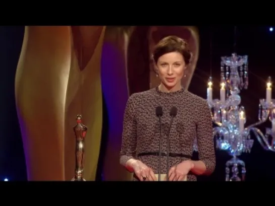 Outlander actress Caitriona Balfe presents Stuart Carolan with the IFTA Award 2015