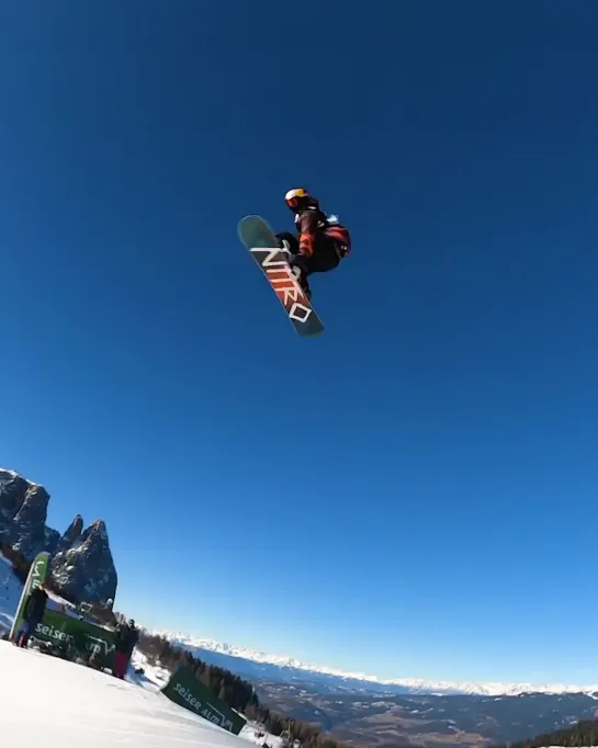 Vlad Khadarin stunts with snowboard