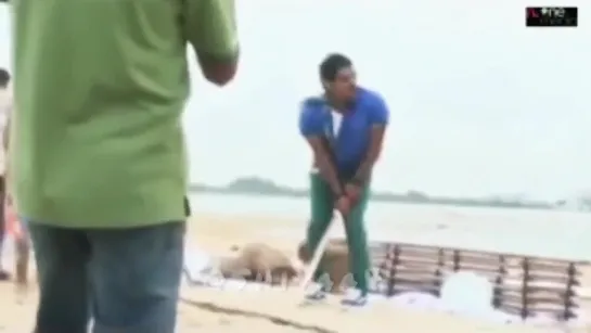 Vikram plays cricket with children during the filming of the movie Rajapattai