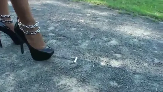 TAMIA CRUSHES 2 CIGARETTES IN A PARK IN NICE HIGH HEELS (1).mp4