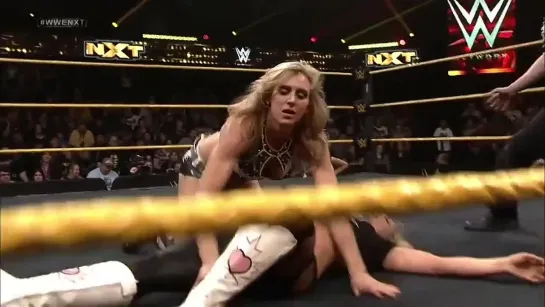 Natalya (w/Bret Hart) vs Charlotte (w/Sasha Banks)