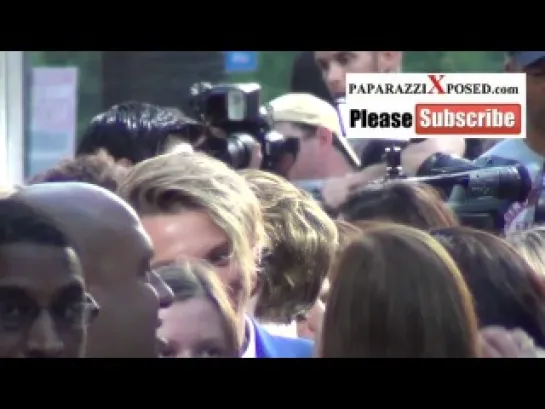 Jamie Campbell Bower greets fans outside premiere of The Mortal Instruments City of Bones at ArcLigh