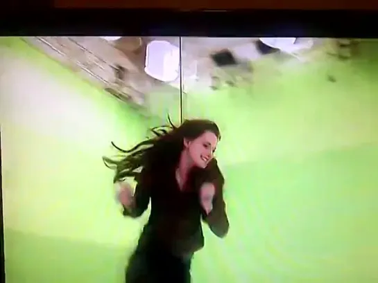 Kristen squealing as she flies across the room on a wire