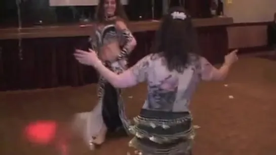 Maria - belly dancing with guests at a party