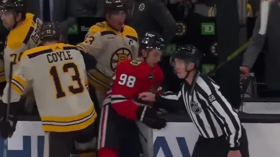 Brad Marchand pushes Bedard to the Boston bench