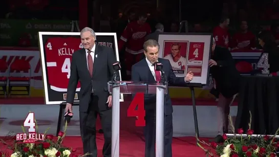 Red Wings raise a banner with the number Red Kelly