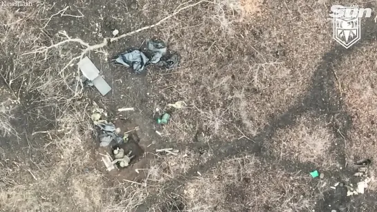 Russian soldiers catch fire as Ukrainian drones drop bombs on foxholes