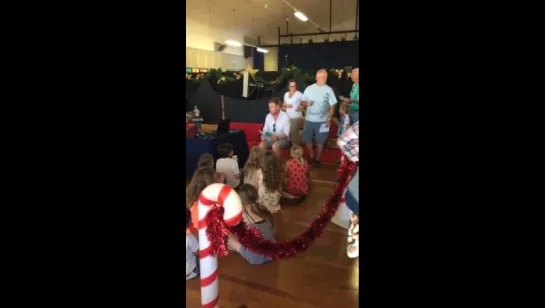 Richard at Bilgola Plateau Public School Christmas Fair reading "Artie and the Grime Wave"