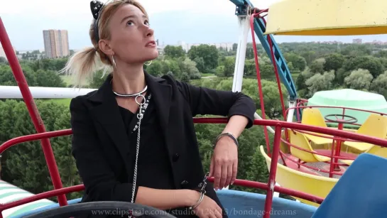 Sofi - Bondage walk in handcuffs in an amusement park