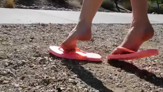 Emily modeling sexy pink flip flops and pale skin