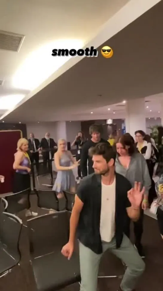 Ben Barnes and Calahan Skogman playing musical chairs with fans at the Saturday Night Pizzama Party during ASOCAS in Paris. - -