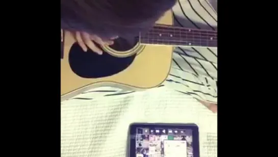 Taehyung playing the guitar