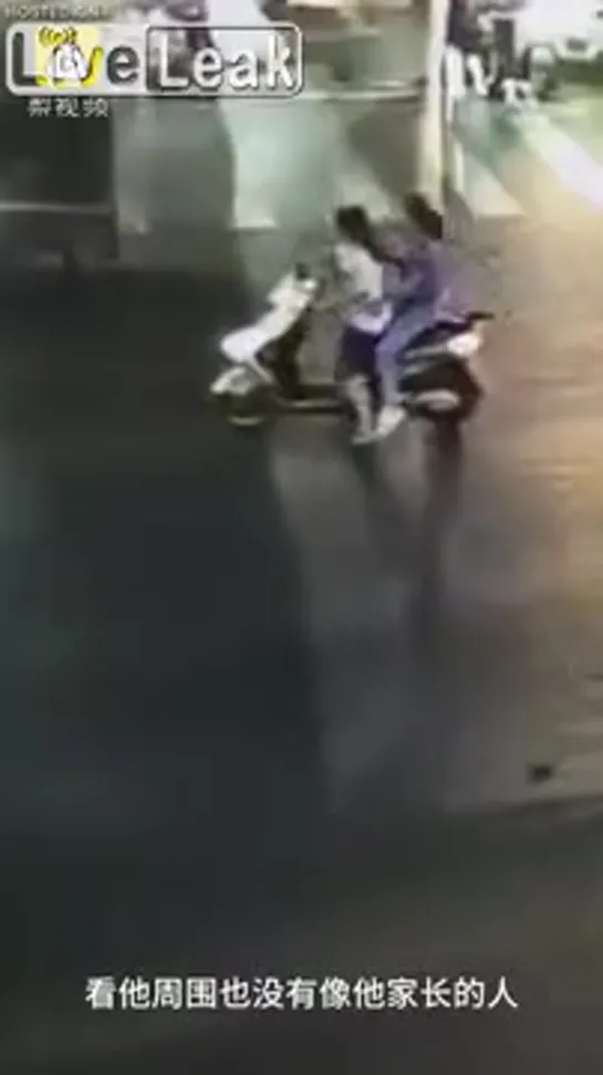 Female scooterist stops a child from being struck by a car