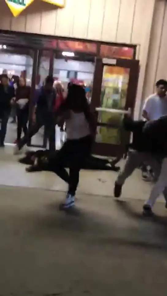 Guy knocks out girl while getting jumped