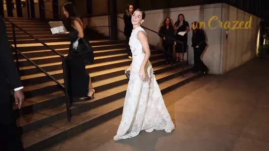 Emma Watson arrives for dinner in New York in a white dress