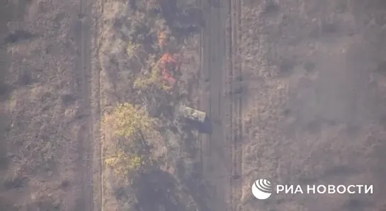 Russian kamikaze drone takes out Ukrainian infantry vehicle during special military operation, RIA Novosti footage shows