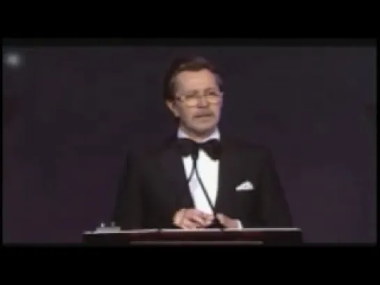 Gary Oldman presenting an award to Matthew McConaughey at the Palm Springs International Film Festival (2014)