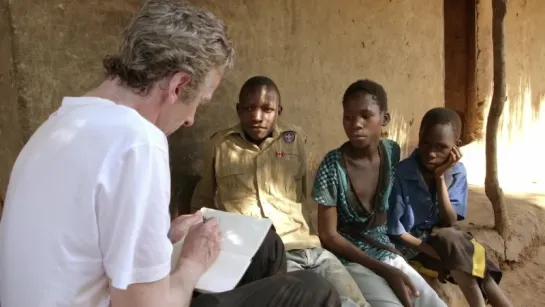 Peter Capaldi meets 3 children in Malawi