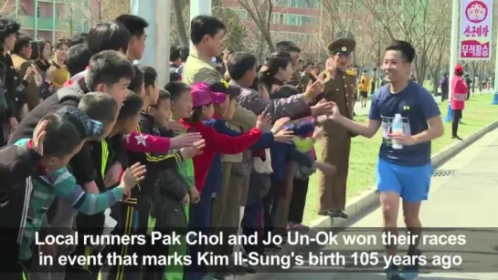 High-fives and presidential portraits at Pyongyang Marathon