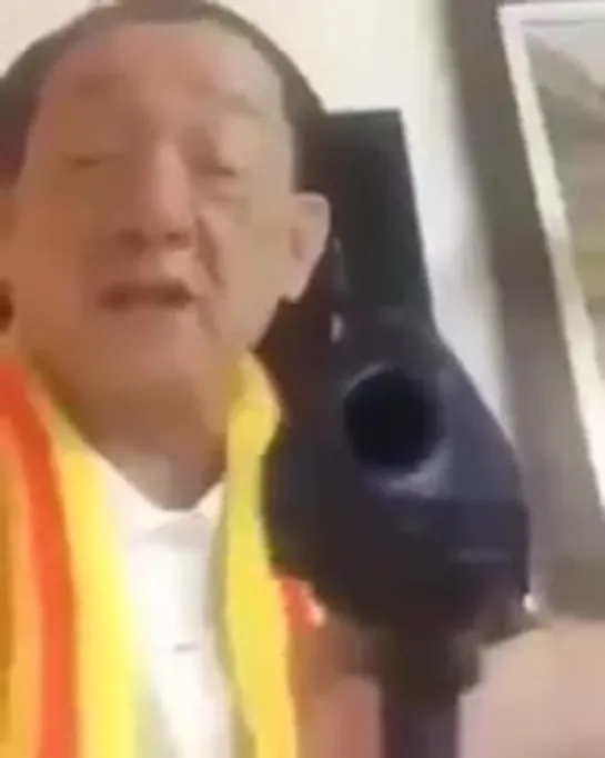 angry chinese guy with a gun