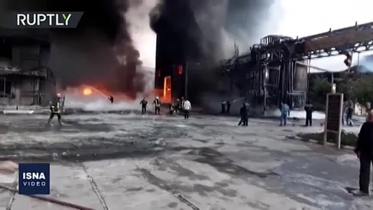 IRANIAN FIREFIGHTERS BATTLE MASSIVE BLAZE AT ALCOHOL FACTORY NEAR TEHRAN.