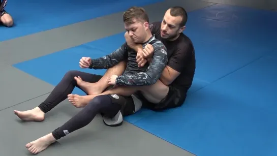 Transitioning between armbar and back control. Lachlan Giles