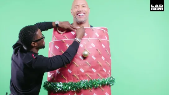 Jumanjis Dwayne The Rock Johnson and Kevin Hart Dress Each Other With Christmas Decorations