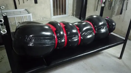 Kris inside the Inflatable Latex Sack teaser