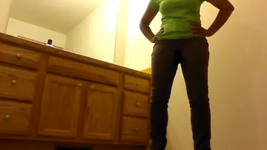 Girl wets her tight jeans after a long hold