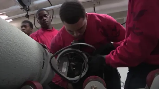 U.S. Navy Sailors Assemble GBU-54 Bombs on USS George H.W. Bush