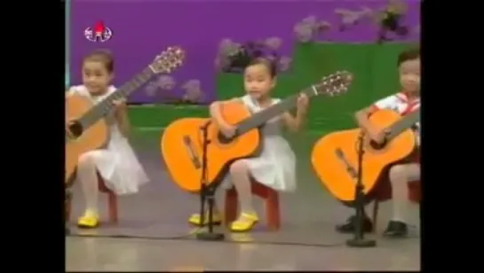 North Korea children playing the guitar. Creepy as hell