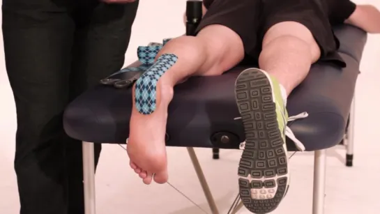 Rocktape application for an Achilles tendon injury